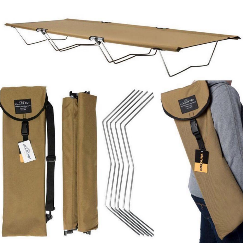 Camping cot with carrying bags and stakes on a white background