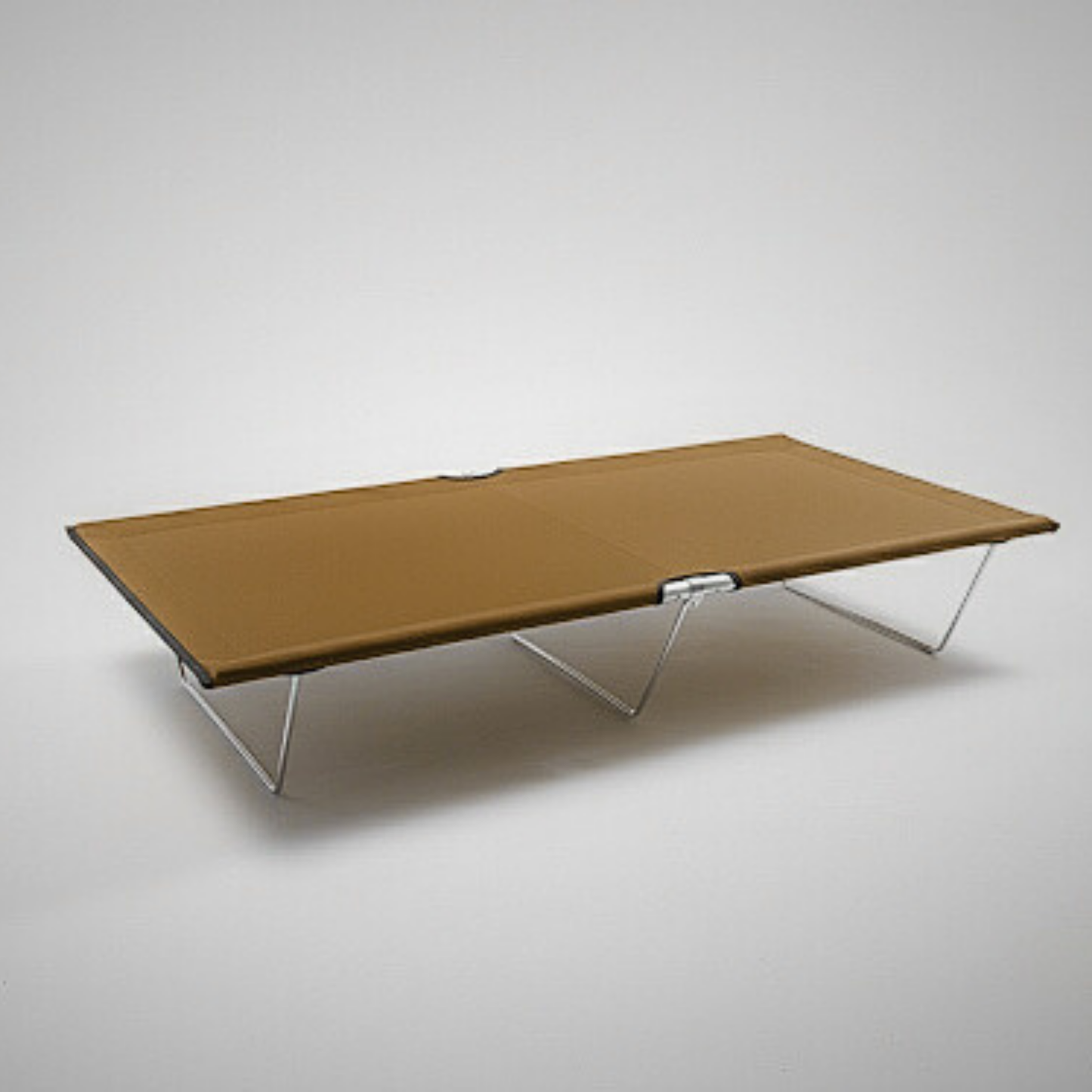 Tan K9-KOT camping cot on a white background